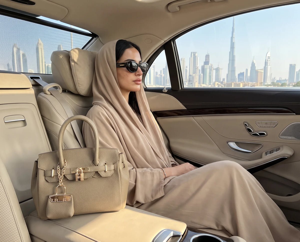 Blush Lola bag on a car seat