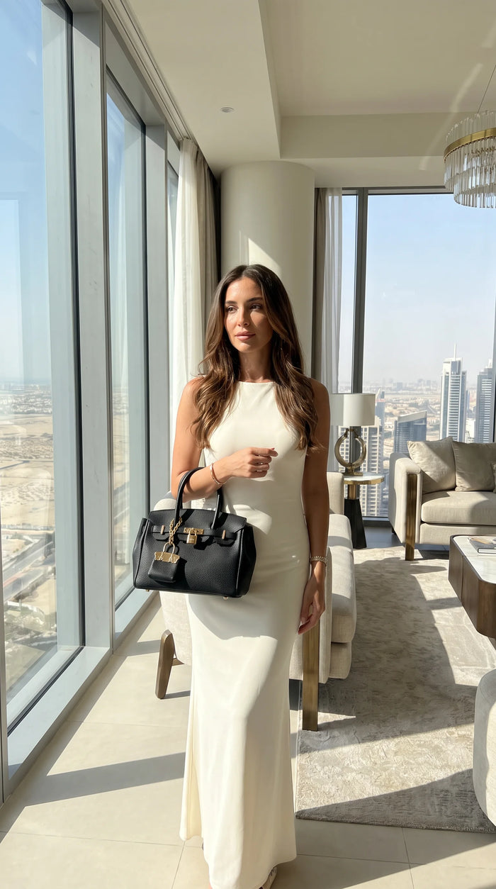 Mocha Lola bag worn with a long dress