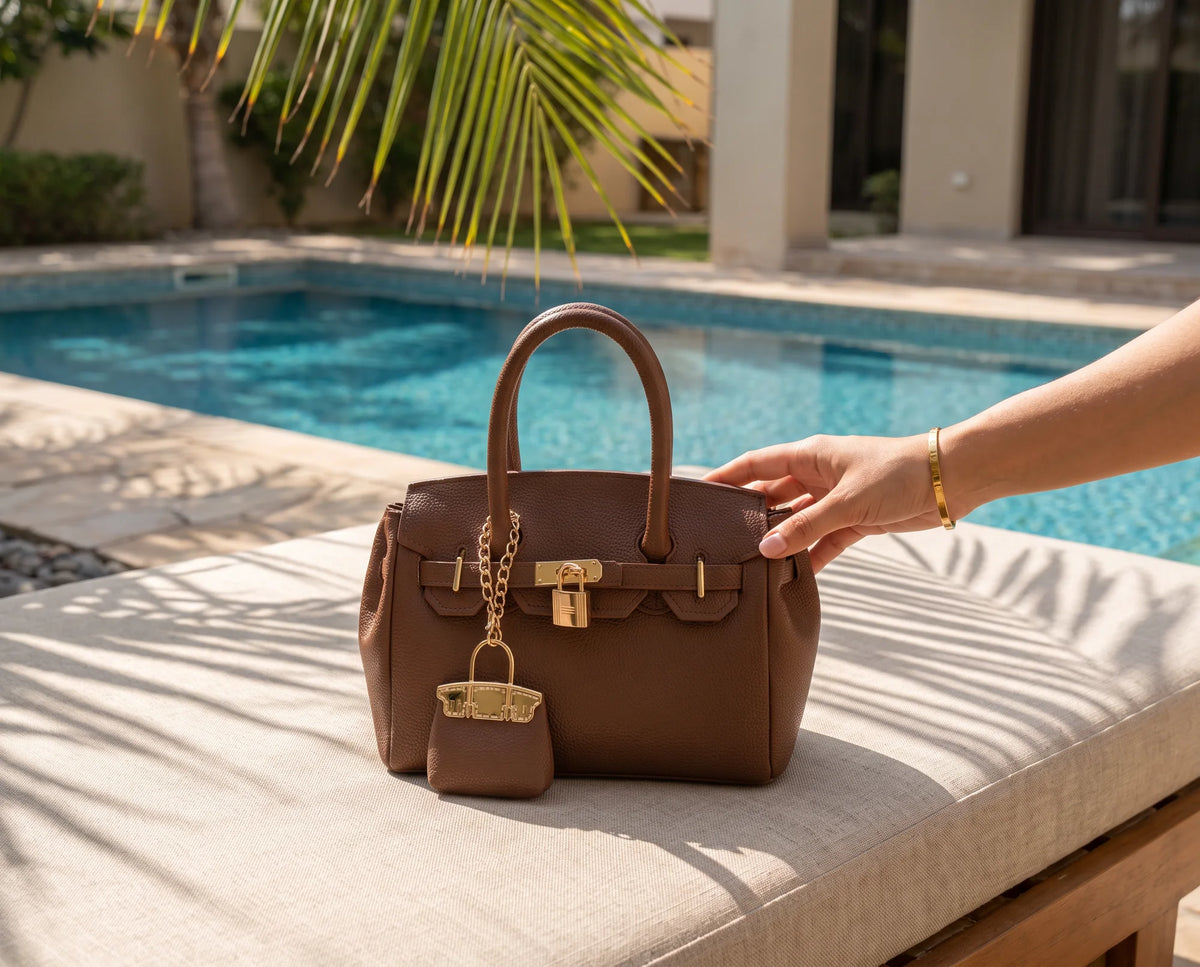 Mocha Lola bag beside a lounger
