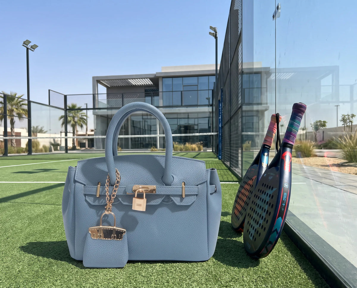 Azure Lola bag at a padel court